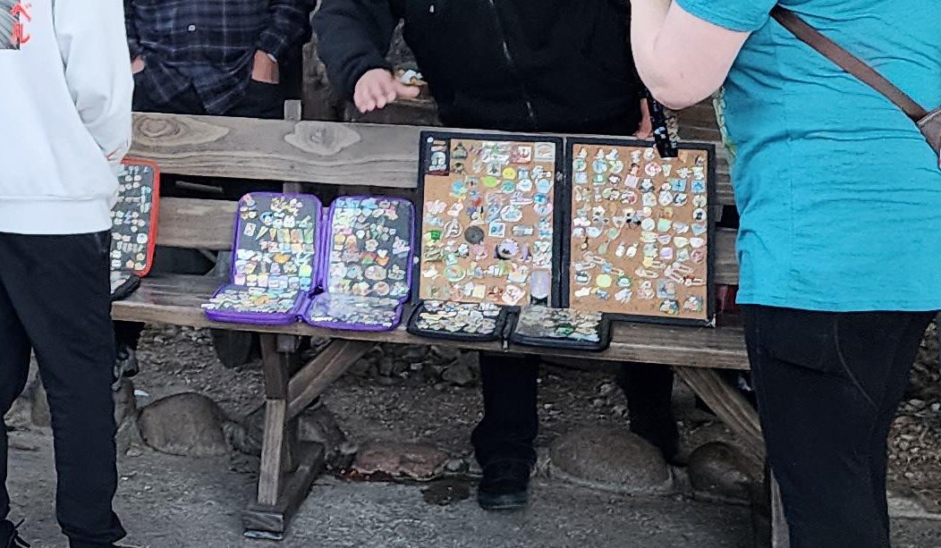 Disneyland Resort updates pin trading policies, bans displaying pins on benches
